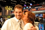 San Jose State University journalism student Justin Alegri gets a kiss from CNN anchor Kyra Phillips in the CNN newsroom.